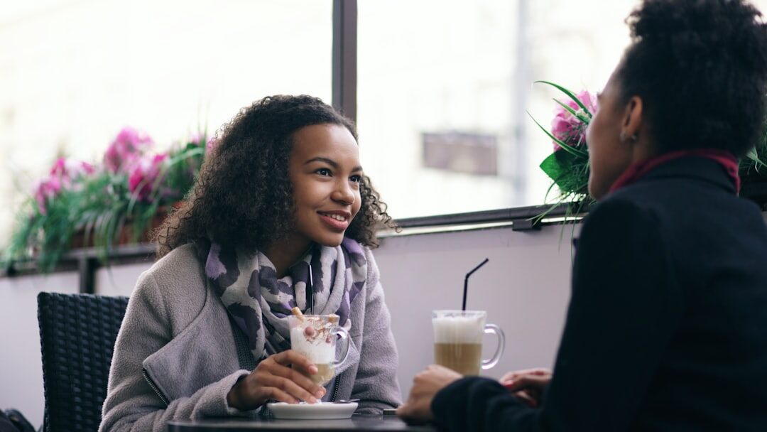 two people talking in cafe