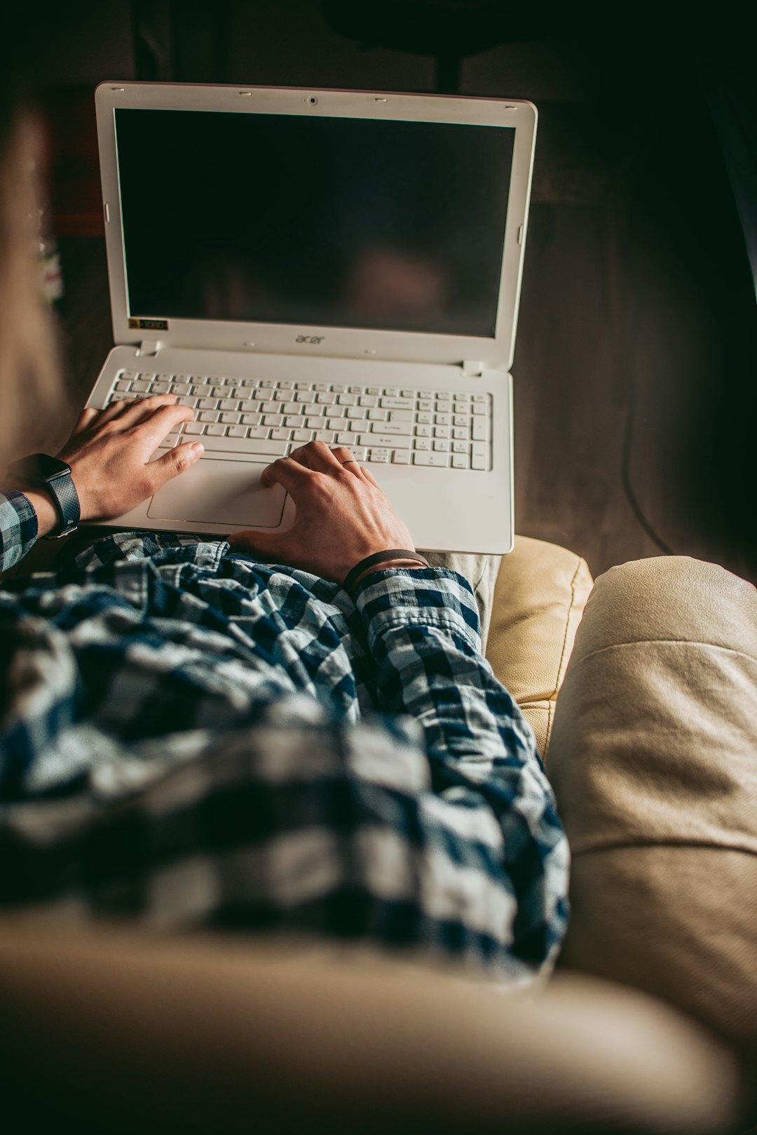writer typing on laptop