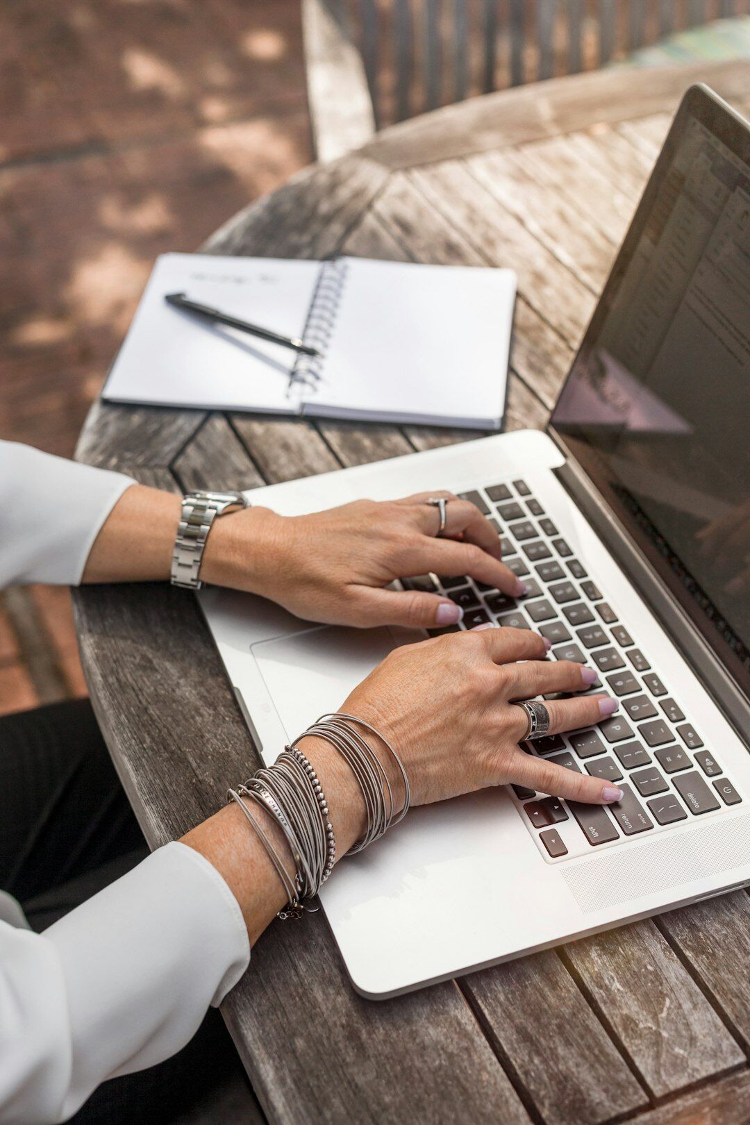 author typing on laptop